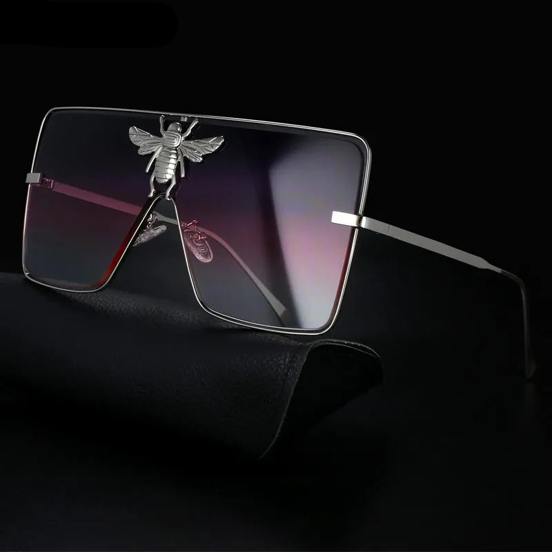 Luxury square metal sunglasses with UV400 protection and bold fashion frame for women.