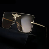 Luxury square metal sunglasses with UV400 protection and bold fashion frame for women.