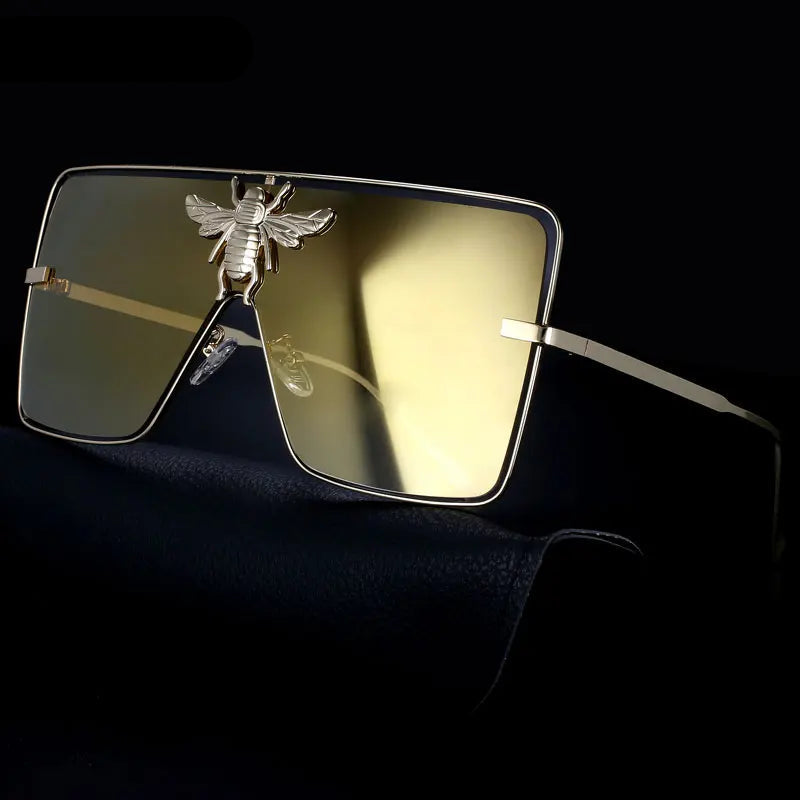 Luxury square metal sunglasses with UV400 protection and bold fashion frame for women.