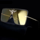 Luxury square metal sunglasses with UV400 protection and bold fashion frame for women.
