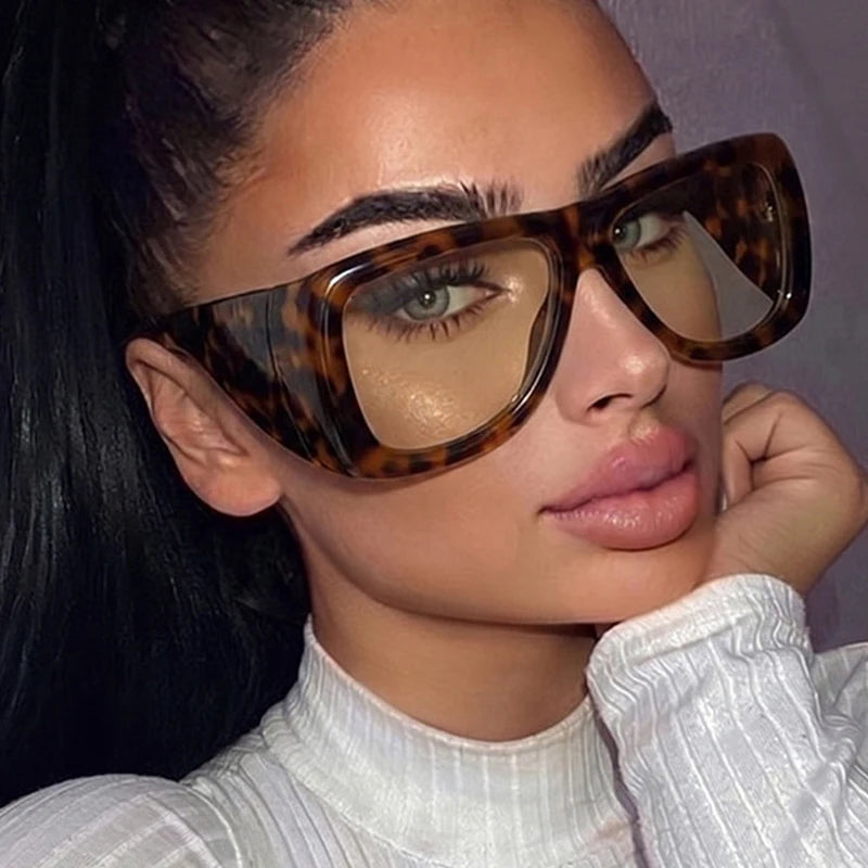 Oversized square jelly color sunglasses with wide frame design and UV400 protection for retro outdoor fashion style.
