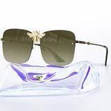 Square metal retro sunglasses with UV400 protection and luxury-inspired frame for women.