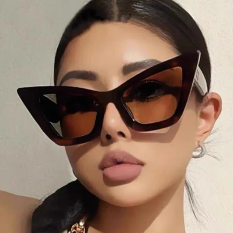 Vintage cat-eye sunglasses with square frame design for women, retro fashion eyewear for outdoor and everyday style.