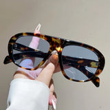 Women’s vintage sunglasses in black and red elegant design, trendy retro outdoor fashion eyewear with UV400 protection.