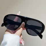 Women’s vintage sunglasses in black and red elegant design, trendy retro outdoor fashion eyewear with UV400 protection.