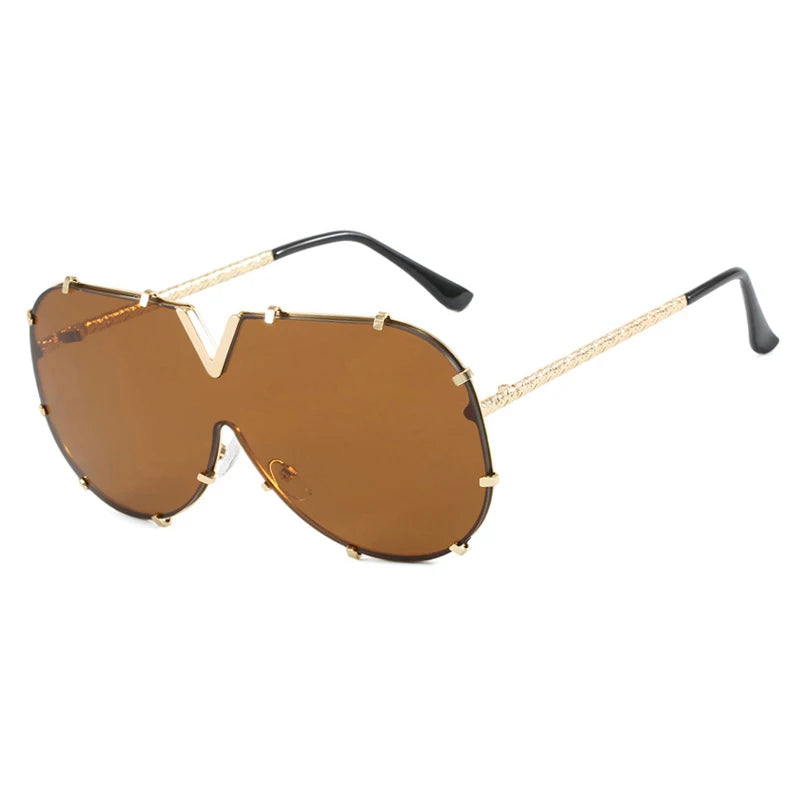 Women’s oversized pilot sunglasses with rivet metal frame and UV400 protection for driving, travel, and outdoor fashion.