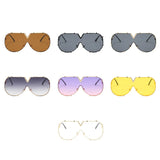 Women’s oversized pilot sunglasses with rivet metal frame and UV400 protection for driving, travel, and outdoor fashion.