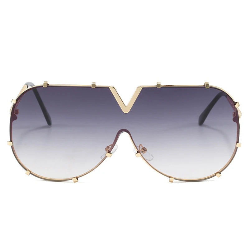 Women’s oversized pilot sunglasses with rivet metal frame and UV400 protection for driving, travel, and outdoor fashion.