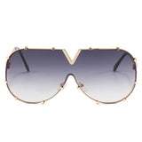 Women’s oversized pilot sunglasses with rivet metal frame and UV400 protection for driving, travel, and outdoor fashion.