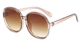 Women’s oversized round vintage sunglasses with plastic frame and luxury designer-inspired style.