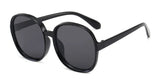 Women’s oversized round vintage sunglasses with plastic frame and luxury designer-inspired style.