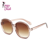 Women’s oversized round vintage sunglasses with plastic frame and luxury designer-inspired style.
