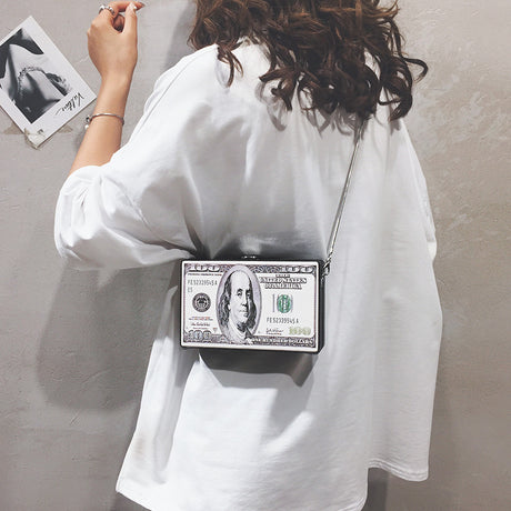 Model using Dollar Pattern Clutch Bag